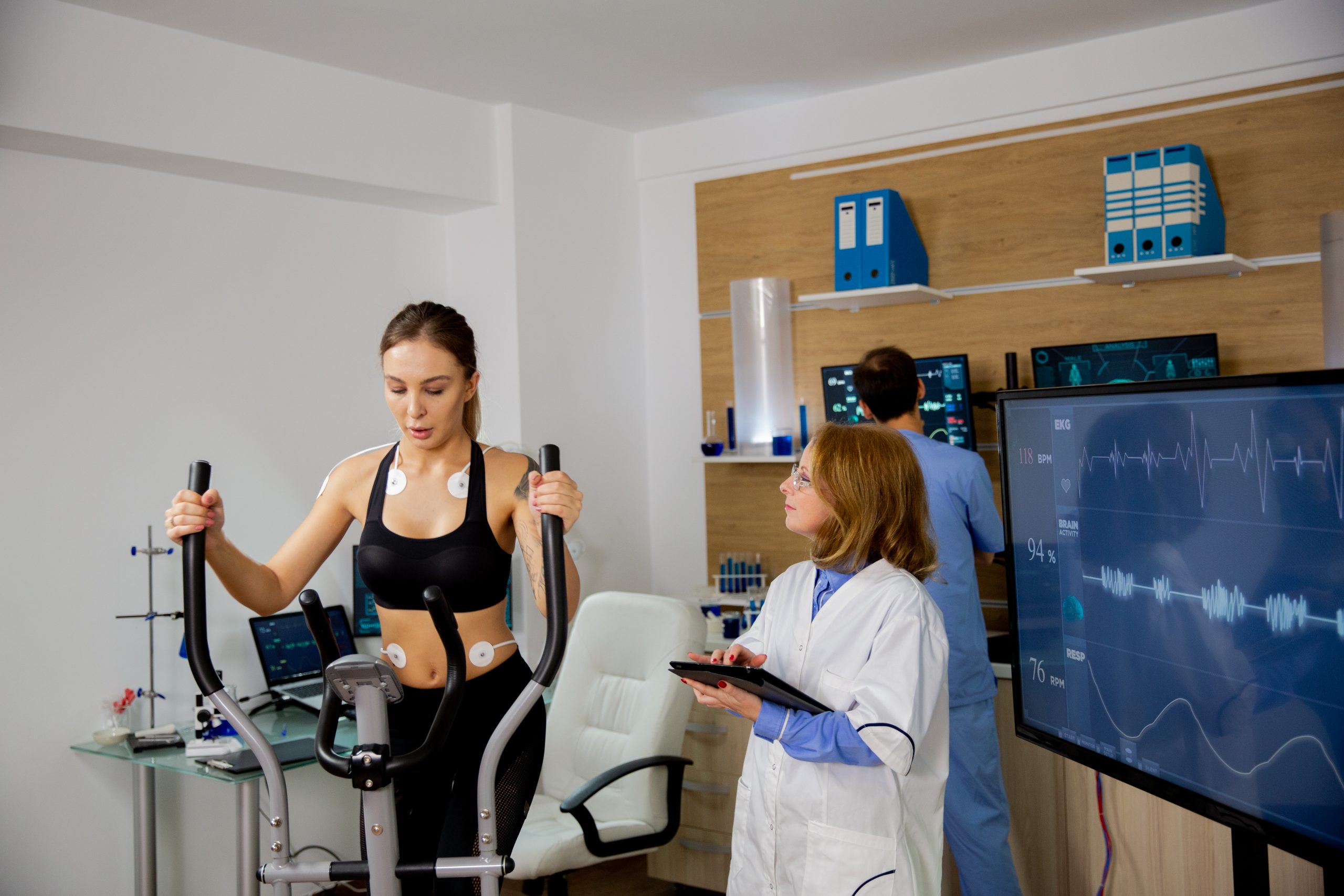Female Athlete Doing Physical Effort Stepper Doctor Follows Her Sports Laboratory Scaled